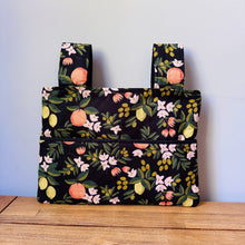 Load image into Gallery viewer, Black citrus and flora walker bag with black interior
