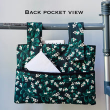 Load image into Gallery viewer, Green Mistletoe Christmas walker bag with pockets and black quilted interior
