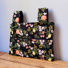 Load image into Gallery viewer, Black citrus and flora walker bag with black interior
