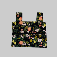 Load image into Gallery viewer, Black citrus and flora walker bag with black interior
