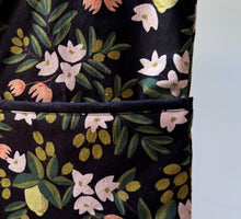 Load image into Gallery viewer, Black citrus and flora walker bag with black interior
