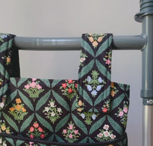Load and play video in Gallery viewer, Green Mistletoe Christmas walker bag with pockets and black quilted interior
